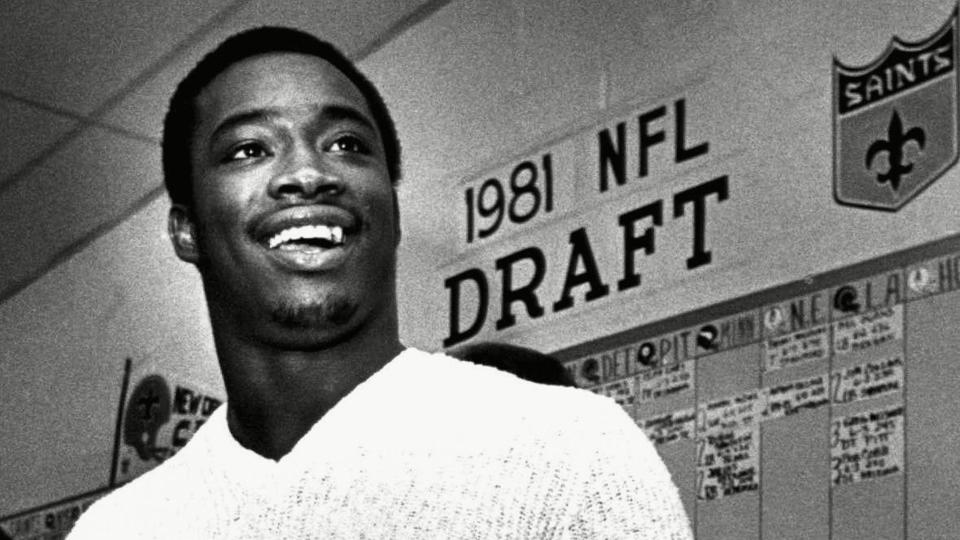 Mandatory Credit: Photo by Jackson Hill/AP/Shutterstock (6595773a)Heisman Trophy winner George Rogers smiles as he holds a New Orleans Saints jersey during a news conference,, in New Orleans.