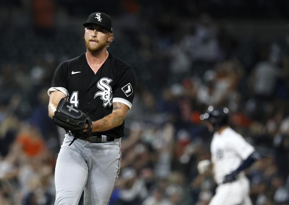 Chicago White Sox's Michael Kopech, left, reacts after giving up a home run to Detroit Tigers' Matt Vierling, right, during the seventh inning of a baseball game Saturday, Sept. 9, 2023, in Detroit. (AP Photo/Duane Burleson)