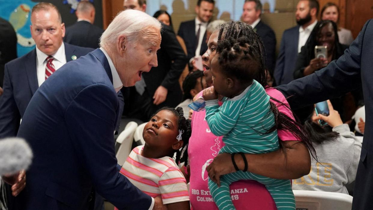 PHOTO: President Joe Biden greets Andrea Dyess and her family during an event held at a community center in Racine County, Wisconsin, May 8, 2024. (Kevin Lamarque/Reuters)