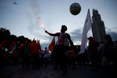 A demonstrator attend a protest against Brazilian social welfare reform project, in Rio de Janeiro, Brazil, March 15, 2017. REUTERS/Ricardo Moraes