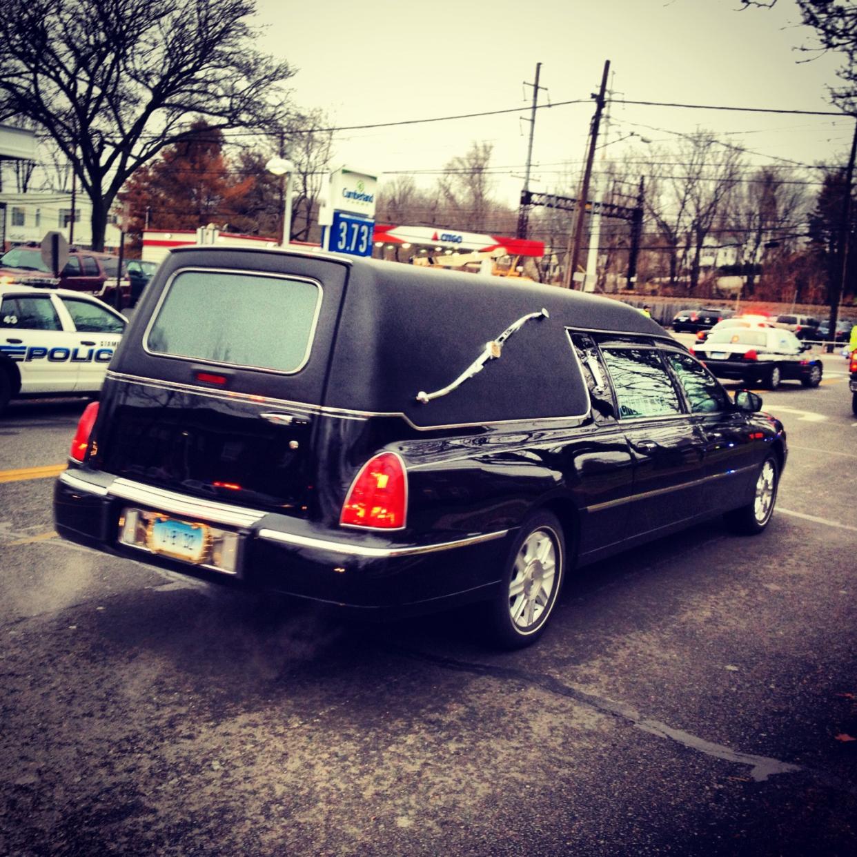 The hearse carrying 6-year-old Newtown shooting victim Noah Pozner leaves a funeral home.