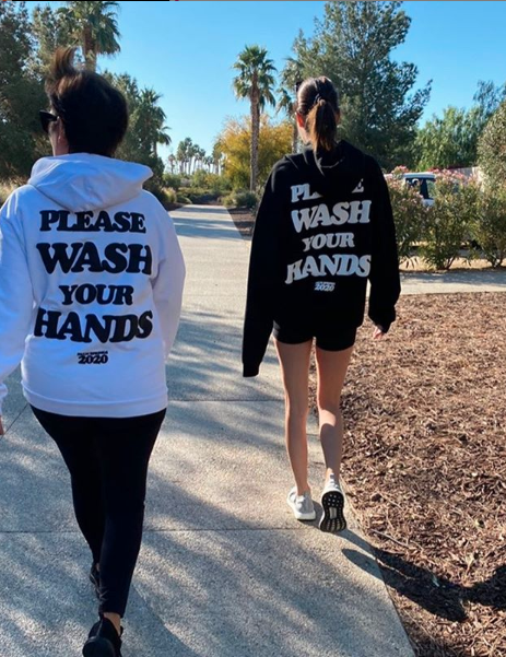 Back of Kris Jenner and Kendall Jenner waring Talentless hoodies