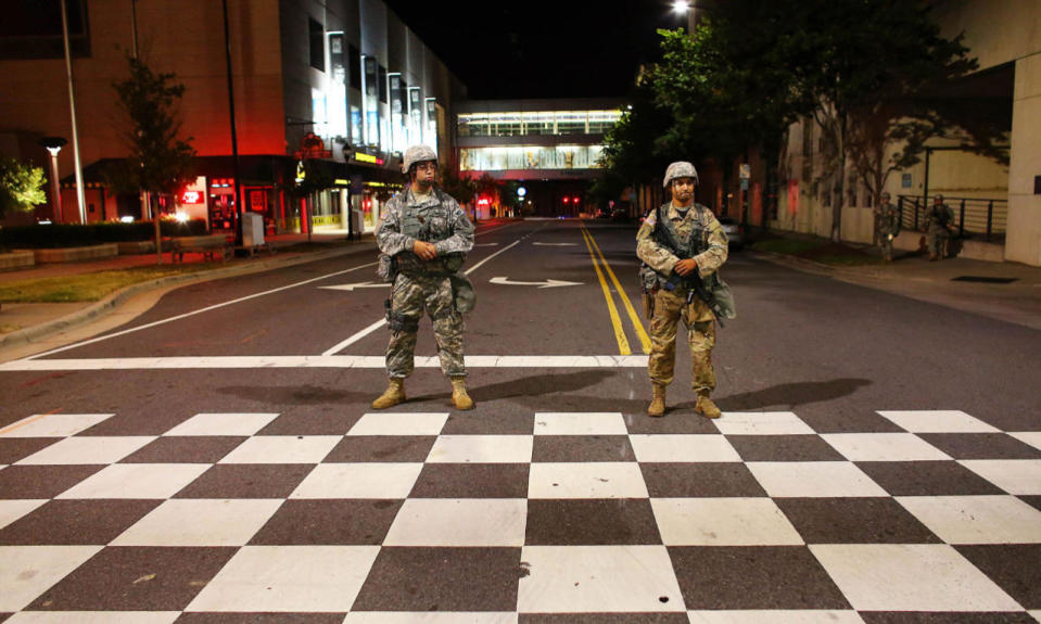 <p>National Guard soldiers watch as protesters march during another night of protests over the police shooting of Keith Scott in Charlotte, North Carolina, U.S. September 23, 2016. (Mike Blake/Reuters)</p>