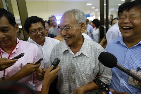 Brigadier General Thein Swe speaks to the media as he arrives at Yangon domestic airport, after being released from a prison near Mandalay October 7, 2014. REUTRS/Soe Zeya Tun