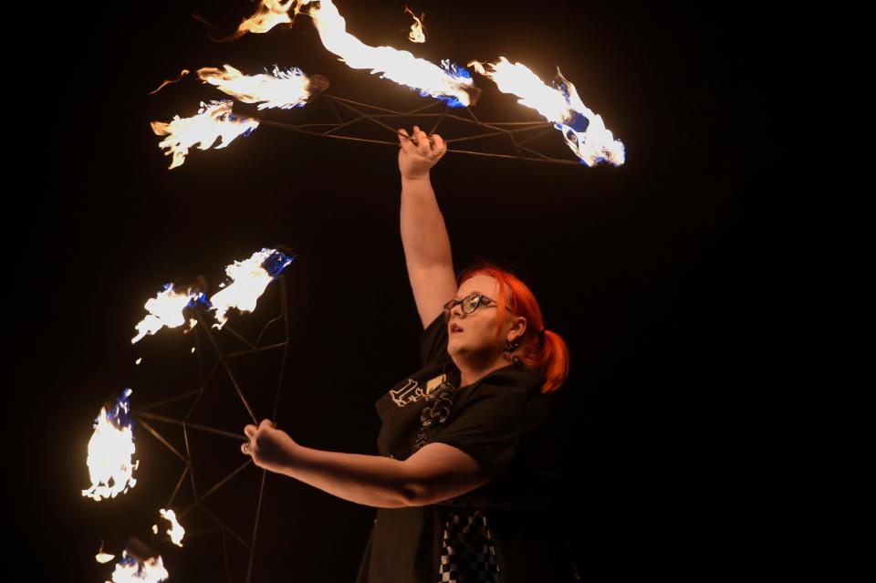 FILE - Amanda Waymer performs with Arcane Arts. The fire dancers will perform at First Friday in downtown Augusta.