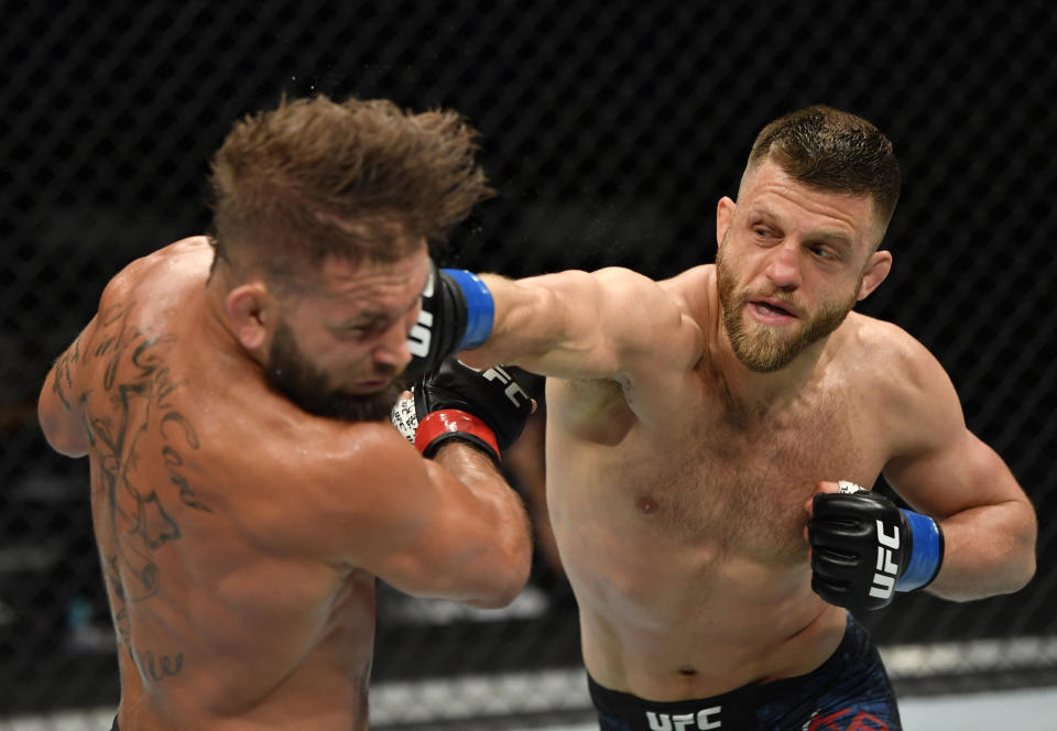 JACKSONVILLE, FLORIDA - MAY 09: (R-L) Calvin Kattar punches Jeremy Stephens in their featherweight fight during the UFC 249 event at VyStar Veterans Memorial Arena on May 09, 2020 in Jacksonville, Florida. (Photo by Jeff Bottari/Zuffa LLC)