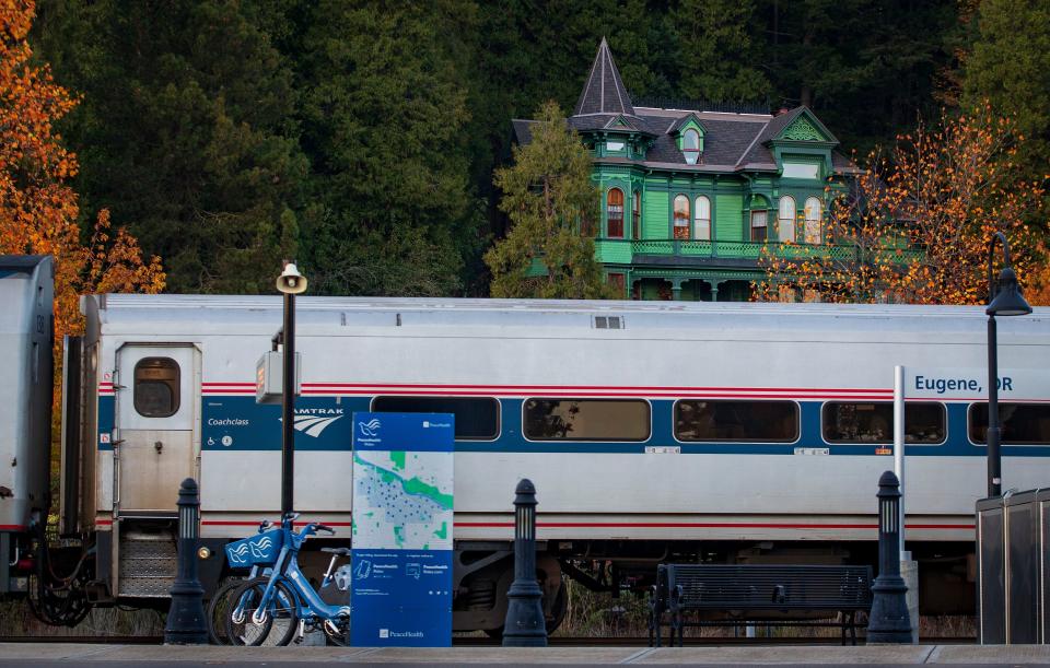 An Amtrak train departs Eugene Station downhill of the Shelton McMurphy Johnson House Museum. The city of Eugene has been working since 2015 to establish a railroad quiet zone by making safety improvements at 10 railroad crossings between Hilyard and Van Buren streets, an area that spans east to west from near the University of Oregon to the heart of the Whiteaker.