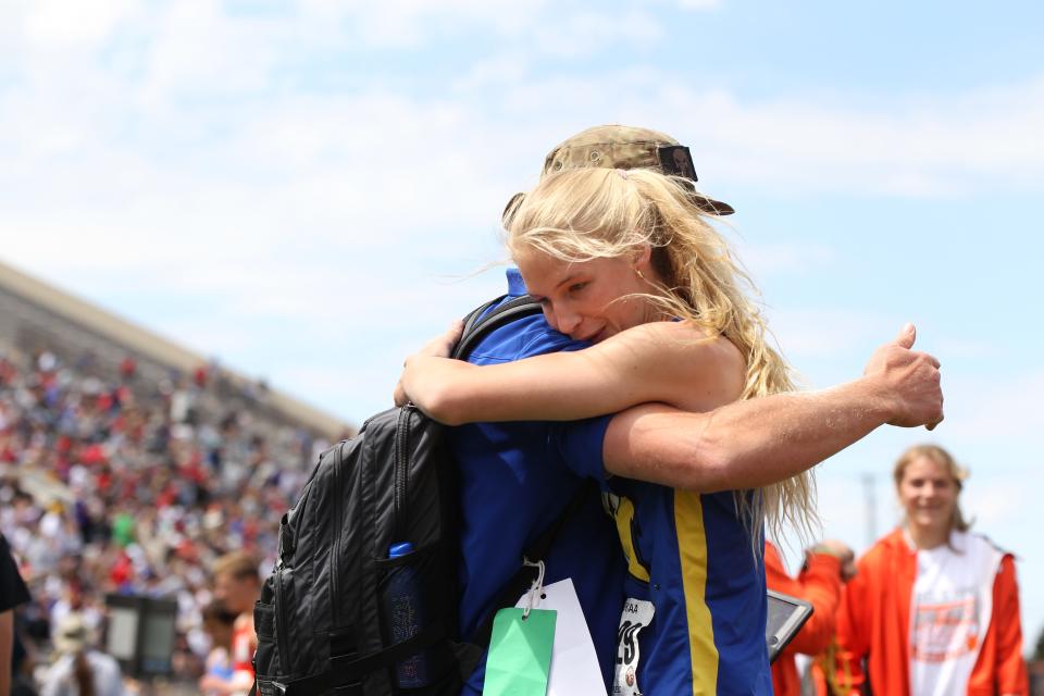 Nickerson's Ava Jones hugs her father after winning the 4A girls high jump at the Kansas state high school track and field championships at Wichita State's Cessna Stadium Friday, May 28, 2021.