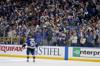 Fans cheer after a goal by St. Louis Blues' David Perron (57) during the first period in Game 4 of an NHL hockey Stanley Cup second-round playoff series between the St. Louis Blues and the Colorado Avalanche Monday, May 23, 2022, in St. Louis. (AP Photo/Jeff Roberson)