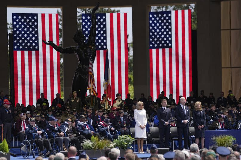 French President Emmanuel Macron, Brigitte Macron, US President Joe Biden, and first lady Jill Biden  attend a ceremony together with World War II veterans in Normandy. 