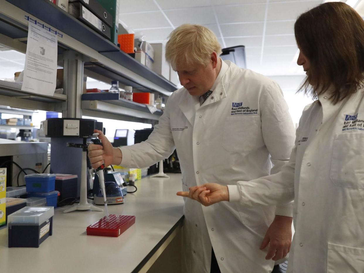 Boris Johnson speaks to Dr Sarah Bowdin during a visit to the National Institute for Health Research at the Cambridge Clinical Research Facility, in Addenbrooke's Hospital in Cambridge: PA