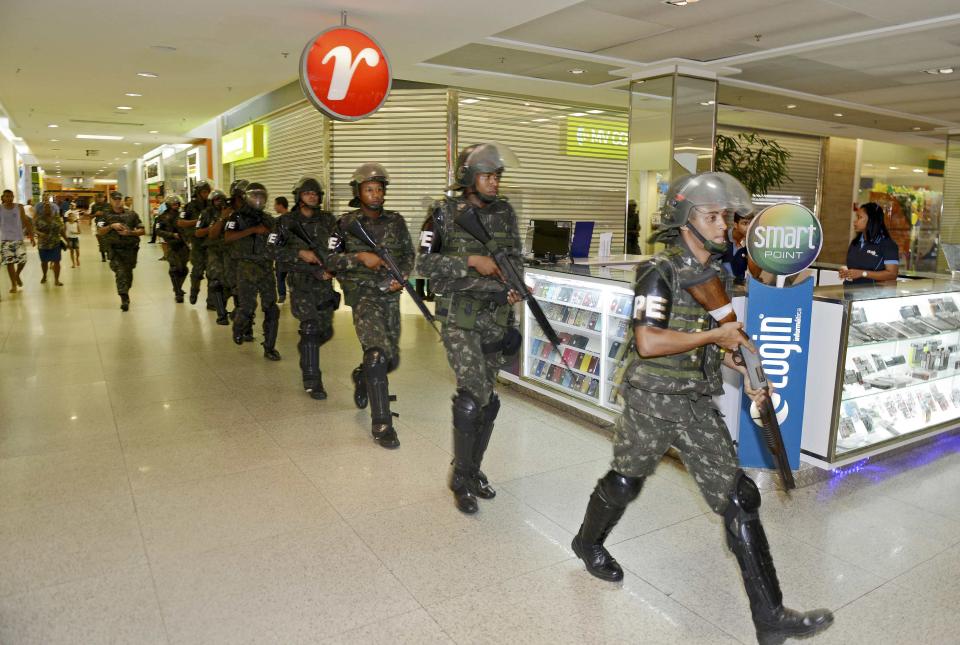 Soldiers patrol the city center during a police strike in Salvador