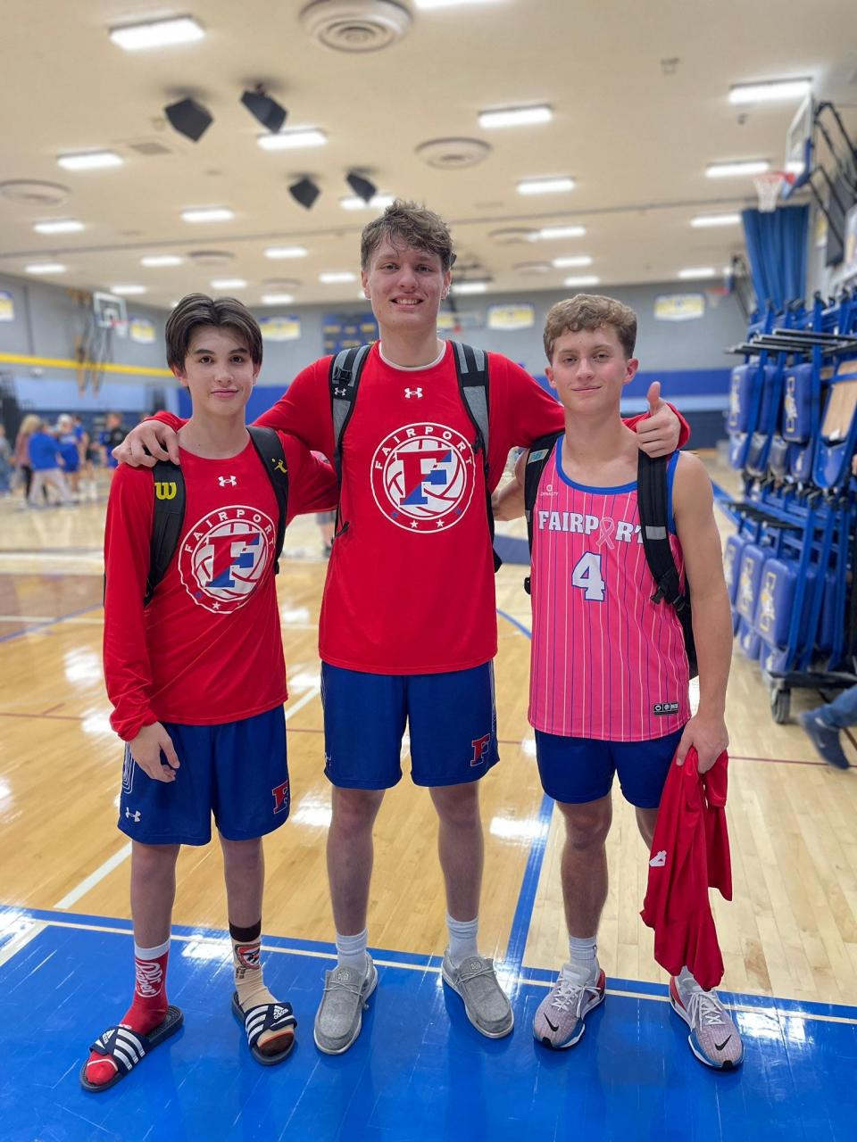 Fairport boys volleyball players Adam Cornman, Aidan White and Drew Sisson.