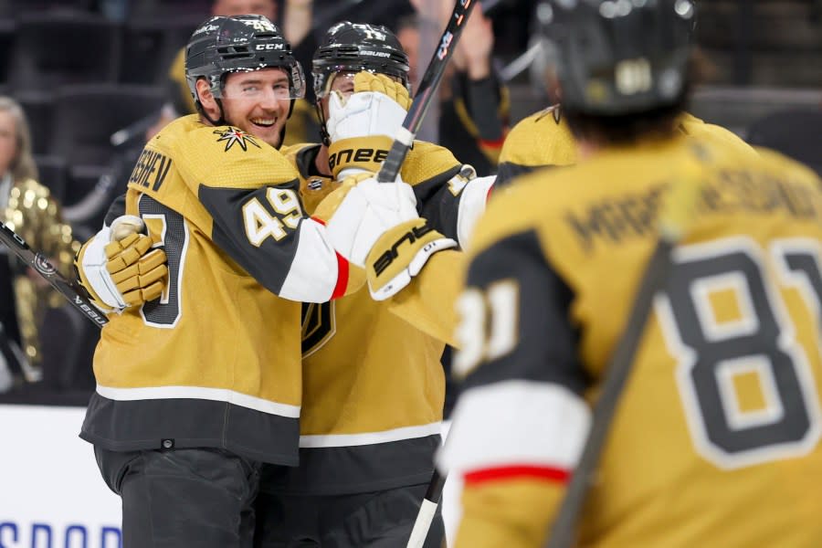 Vegas Golden Knights center Ivan Barbashev (49) celebrates after scoring a goal against the Columbus Blue Jackets during the second period of an NHL hockey game Saturday, March 23, 2024, in Las Vegas. (AP Photo/Ian Maule)