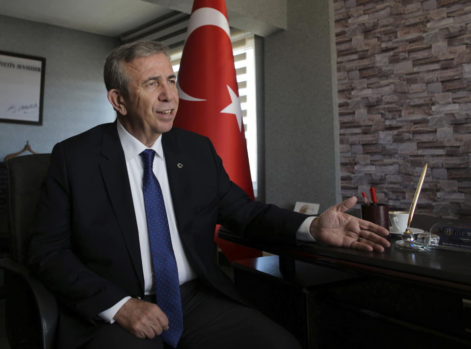 In this Monday, March 25, 2019 photo, Mansur Yavas, the mayoral candidate of Turkey's main opposition alliance for Ankara, talks to The Associated Press in Ankara, Turkey. Opinion polls suggest that Yavas could win the seat of mayor of Ankara, which would be a major blow to Erdogan, whose ruling Justice and Development Party, or AKP, and its Islamic-oriented predecessor have run the city for the past quarter-century. (AP Photo/Burhan Ozbilici)