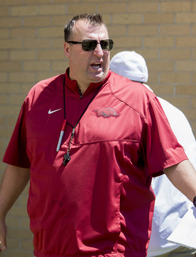 Arkansas head coach Bret Bielema walks off the field before the Razorbacks spring NCAA college football game Saturday, April 25, 2015, in Fayetteville, Ark. (AP Photo/Gareth Patterson)