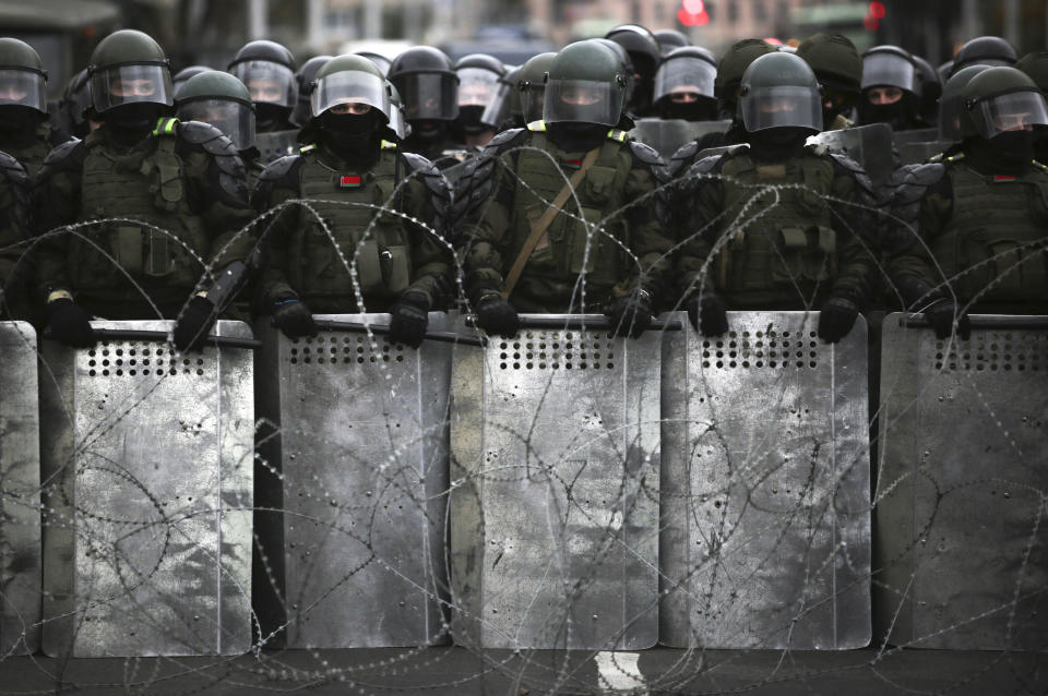 Belarusian police block a street during an opposition rally to protest the official presidential election results in Minsk, Belarus, Sunday, Oct. 25, 2020. The demonstrations were triggered by official results giving President Alexander Lukashenko 80% of the vote in the Aug. 9 election that the opposition insists was rigged. Lukashenko, who has ruled Belarus with an iron fist since 1994, has accused the United States and its allies of fomenting unrest in the ex-Soviet country. (AP Photo)