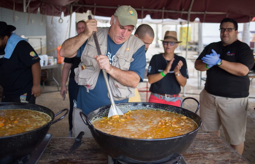 José Andrés stirs a pot of food in San Juan, Puerto Rico - Credit: National Geographic