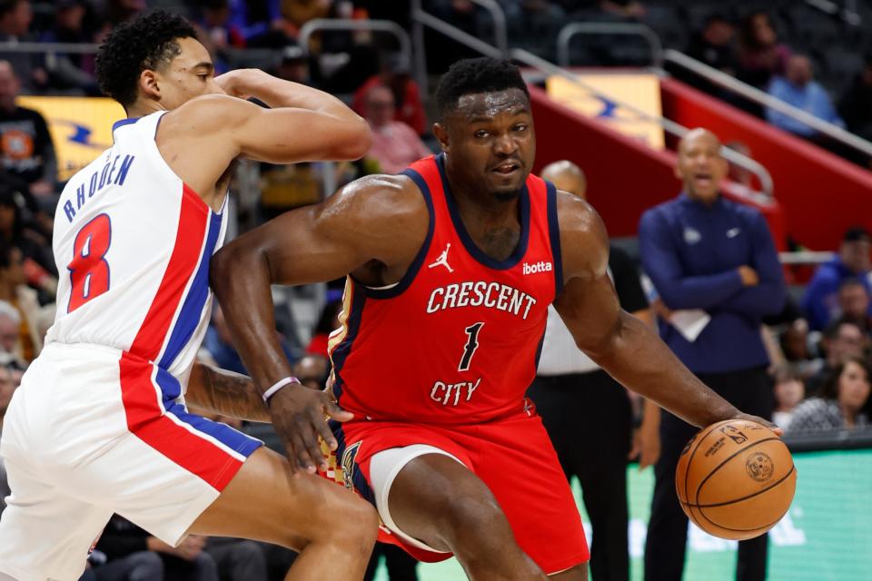 New Orleans Pelicans forward Zion Williamson dribbles on Detroit Pistons guard Jared Rhoden in the first half March 24, 2024 at Little Caesars Arena.