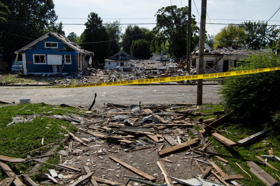 Rescue and cleanup workers take a break from their work at the spot where a house exploded the day before at 1010 N. Weinbach Avenue in Evansville Thursday afternoon, Aug. 11, 2022. The blast killed three people and damaged 39 homes in the area. 
