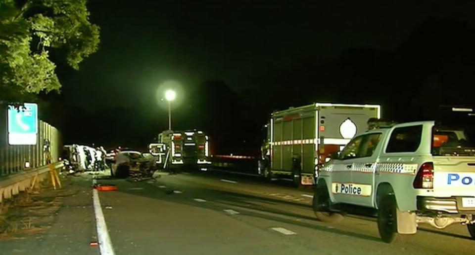 Police and fire trucks at Bald Hills crash in Queensland that killed two people.