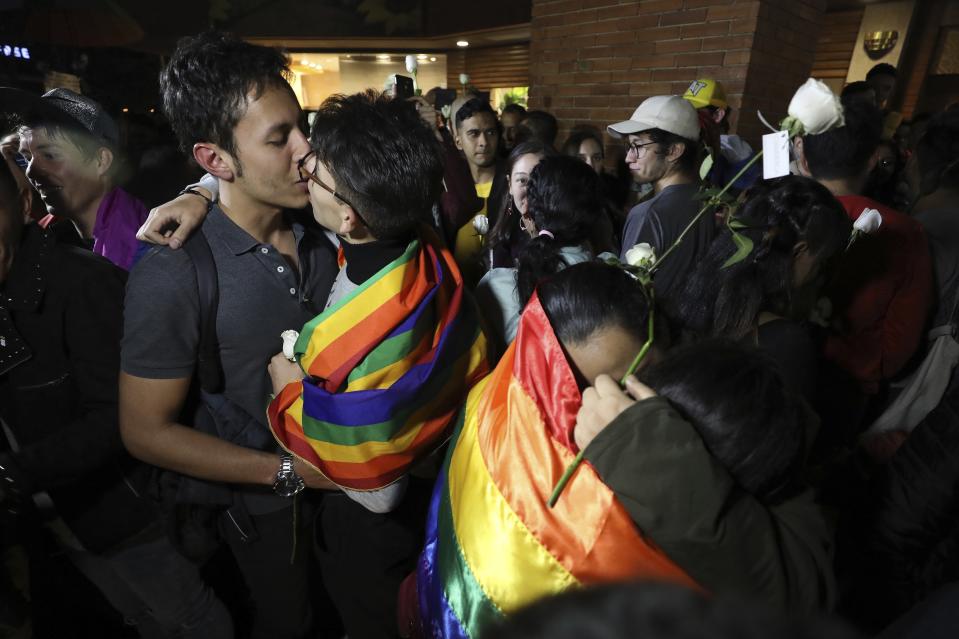 Same sex couples attend a "Kiss-a-thon," as a form of protest for LGBT rights in Bogota, Colombia, Wednesday, April 17, 2019. The event was held at the same Andino shopping mall where days ago two gay men were harassed by a customer who lured police into fining them for "exhibitionism." (AP Photo/Fernando Vergara)