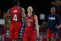 United States' Sue Bird (6), center, celebrates score by teammate Jewell Loyd (4) during women's basketball preliminary round game at the 2020 Summer Olympics, Tuesday, July 27, 2021, in Saitama, Japan. (AP Photo/Eric Gay)