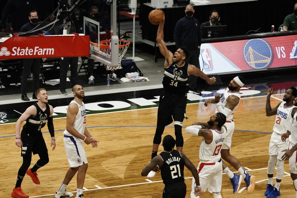 Milwaukee Bucks' Giannis Antetokounmpo dunks during the second half of an NBA basketball game against the LA Clippers Sunday, Feb. 28, 2021, in Milwaukee. The Bucks won 105-100. (AP Photo/Morry Gash)