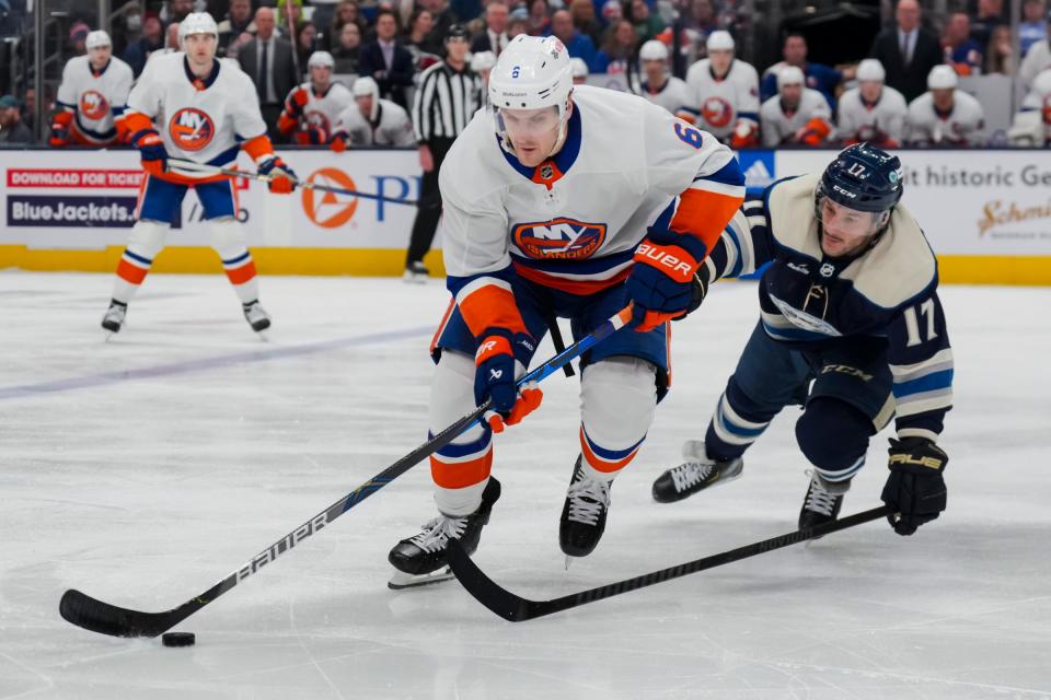 Islanders defenseman Ryan Pulock skates with the puck against Blue Jackets right wing Justin Danforth in the second period on Thursday, April 4, 2024, in Columbus, Ohio.