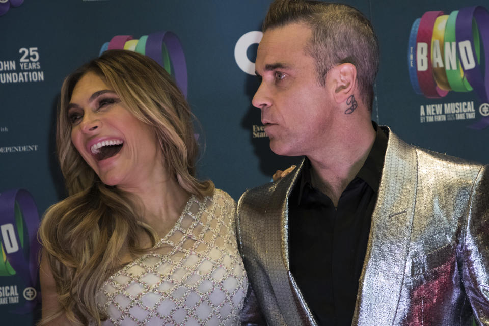 Singer Robbie Williams, right, and actress Ayda Field pose for photographers upon arrival at the premiere of the musical 'The Band', in London, Tuesday, Dec. 4, 2018. (Photo by Vianney Le Caer/Invision/AP)