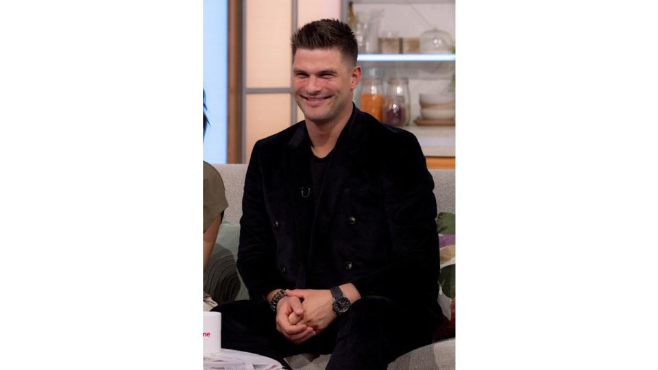 Aljaz Skorjanec in a black outfit