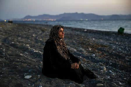 Amoun, 70, a blind Palestinian refugee who lived in the town of Aleppo in Syria, rests on a beach moments after arriving along with another forty on a dinghy in the Greek island of Kos, crossing a part of the Aegean Sea from Turkey to Greece, August 12, 2015. REUTERS/Yannis Behrakis