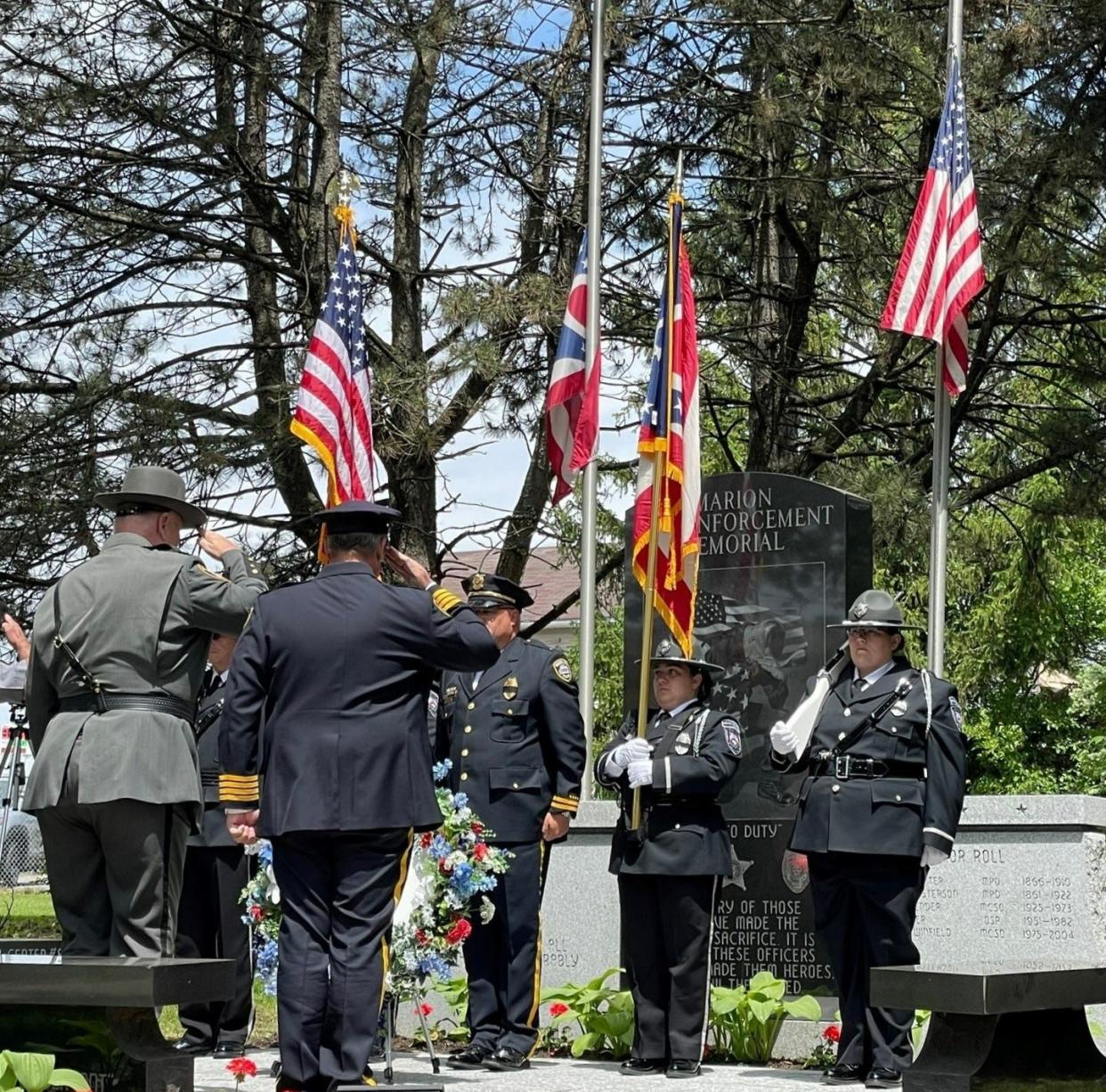 Marion County Sheriff Matt Bayles, left, and Marion Police Chief Jay McDonald salute following the laying of wreaths during the law enforcement memorial service held Thursday, May 25, 2023, at Marion Cemetery. The Marion Correctional Institution Color Guard posted and retrieved the colors during the ceremony. The Marion United Veterans Council served as the honor guard for the ceremony.