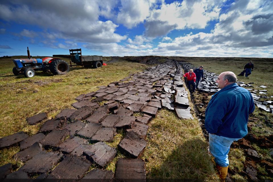 Traditional peat cutting underway in Lewis, ScotlandJeff J Mitchell/Getty