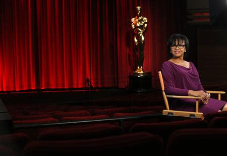 Academy President Cheryl Boone Isaacs poses for a portrait inside the The Samuel Goldwyn theatre at the Academy of Motion Picture Arts and Sciences in Beverly Hills, California February 19, 2014. REUTERS/Mario Anzuoni
