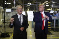 Apple CEO Tim Cook and President Donald Trump speak during a tour of an Apple manufacturing plant, Wednesday, Nov. 20, 2019, in Austin. (AP Photo/ Evan Vucci)