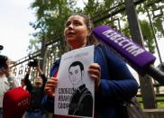 A participant stages a picket in support of former journalist Ivan Safronov in Moscow