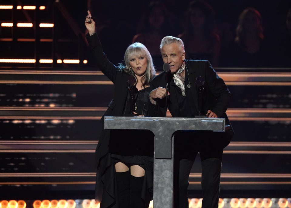 Inductees Pat Benatar, left, and Neil Giraldo speak during the Rock & Roll Hall of Fame Induction Ceremony on Saturday, Nov. 5, 2022, at the Microsoft Theater in Los Angeles. (AP Photo/Chris Pizzello)