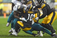 Pittsburgh Steelers quarterback Mitch Trubisky (10) is sacked by Jacksonville Jaguars linebacker Josh Allen (41) during the second half of an NFL football game Sunday, Oct. 29, 2023, in Pittsburgh. (AP Photo/Gene J. Puskar)