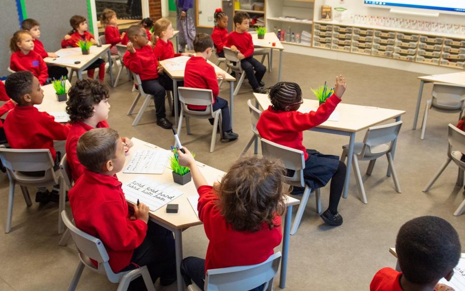 Pupils on the first day back to school at Charles Dickens Primary School in London, as schools in England reopen to pupils following the coronavirus lockdown. Approximately 40% of schools are expected to welcome back students for the start of the autumn term today, despite concerns being raised about their ability to reopen safely. PA Photo. Picture date: Tuesday September 1, 2020. More than a quarter of parents said they were not planning to send their child back to school at the start of term, while a further 20% remained undecided, according to a poll by the charity Parentkind. See PA story EDUCATION Schools. Photo credit should read: Dominic Lipinski/PA Wire