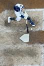 Milwaukee Brewers' Keston Hiura hits a home run during the ninth inning of a baseball game against the Cincinnati Reds Sunday, Aug. 7, 2022, in Milwaukee. (AP Photo/Morry Gash)