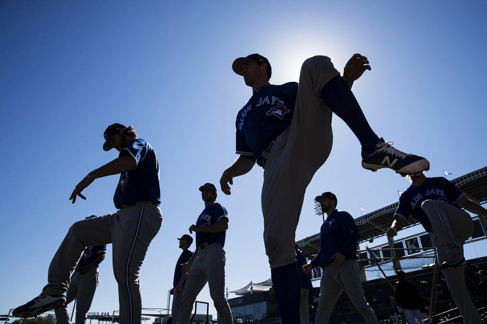 <p>Members of the Toronto Blue Jays warm up ahead of a spring training baseball game against the New York Yankees on Sunday, Feb. 26, 2017, in Tampa, Fla. (Photo: Matt Rourke/AP) </p>