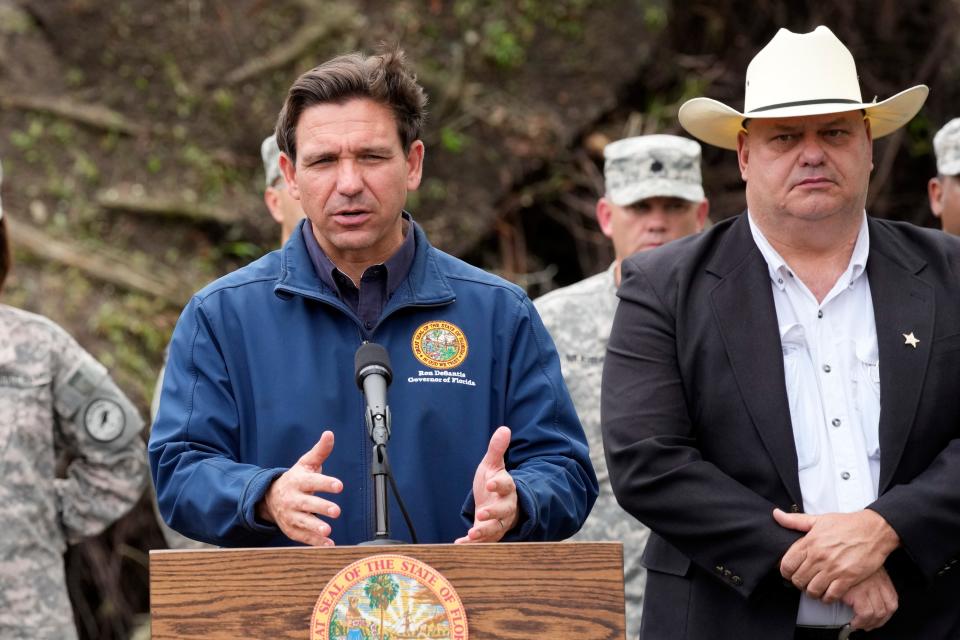 Florida Gov. Ron DeSantis speaks at a news conference with Taylor County Sheriff Wayne Padgett, right, Wednesday, Aug. 30, 2023, in Perry, Fla., in the aftermath of Hurricane Idalia. (AP Photo/John Raoux) ORG XMIT: FLJR105