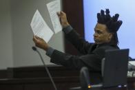 Ronnie Oneal III displays evidence while representing himself during closing arguments for his murder trial at the George E. Edgecomb Courthouse in Tampa, Fla., on Monday, June 21, 2021. (Ivy Ceballo/Tampa Bay Times via AP)