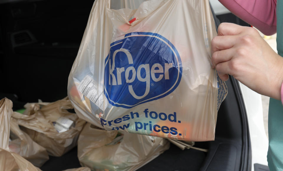 FILE - A customer removes her purchases at a Kroger grocery store in Flowood, Miss., June 26, 2019. Supermarket chains Kroger and Albertsons on Thursday, July 25, 2024, agreed to temporarily halt their proposed merger in Colorado until a judge has considered the state’s objections. (AP Photo/Rogelio V. Solis, File)