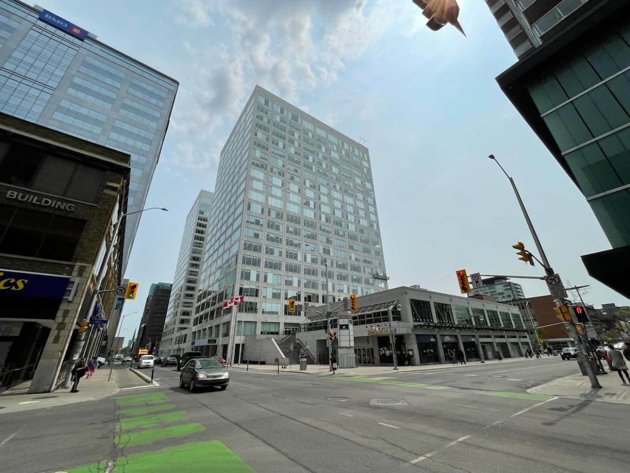 The L'Esplanade Laurier complex in downtown Ottawa, seen here May 19, 2023, has three buildings and a parking garage. (Andrew Foote/CBC - image credit)