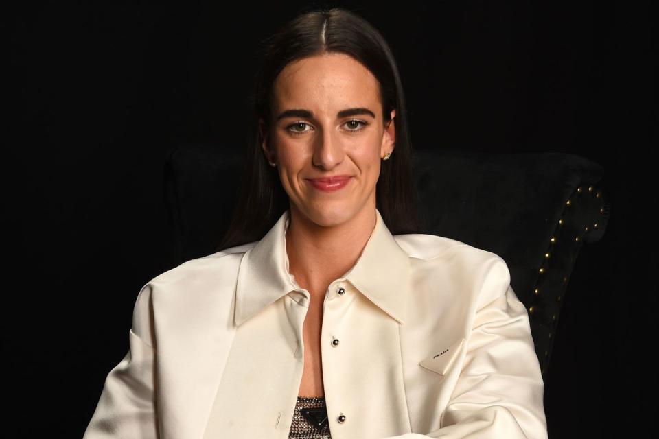 <p>Brian Babineau/NBAE via Getty</p> Caitlin Clark poses for a portrait after being selected first overall by the Indiana Fever during the 2024 WNBA Draft