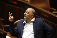 Leader of the United Arab List Mansour Abbas attends a Knesset session in Jerusalem Sunday, June 13, 2021. Bennett is expected later Sunday to be sworn in as the country's new prime minister, ending Prime Minister Benjamin Netanyahu's 12-year rule. (AP Photo/Ariel Schalit)