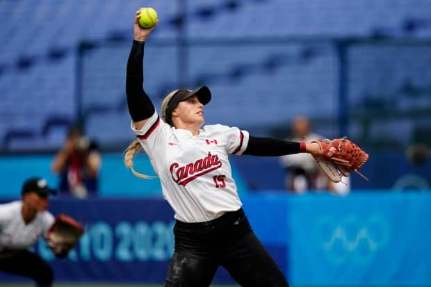 Canada's Danielle Lawrie pitches during a spectator-less softball game against Italy at Yokohama Stadium during the Olympics on Monday in Yokohama, Japan.  (Matt Slocum/The Associated Press - image credit)