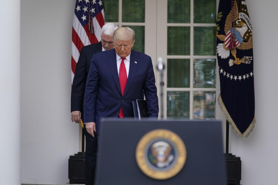 President Donald Trump arrives with Vice President Mike Pence to a news conference about the coronavirus in the Rose Garden of the White House, Friday, March 13, 2020, in Washington. (AP Photo/Evan Vucci)